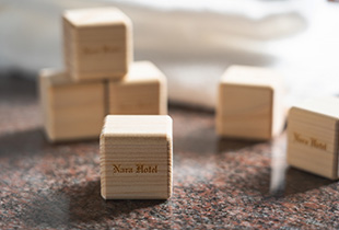 Photo: Original hinoki cubes with hotel logo